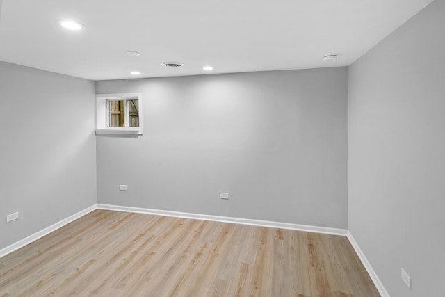 unfurnished room with light hardwood / wood-style floors