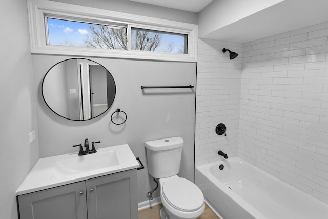 full bathroom featuring vanity, toilet, and tiled shower / bath