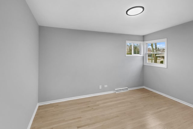 spare room with light hardwood / wood-style floors