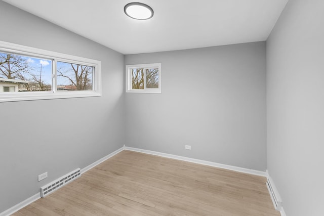 spare room featuring light wood-type flooring