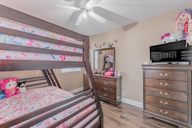 bedroom with ceiling fan and wood-type flooring