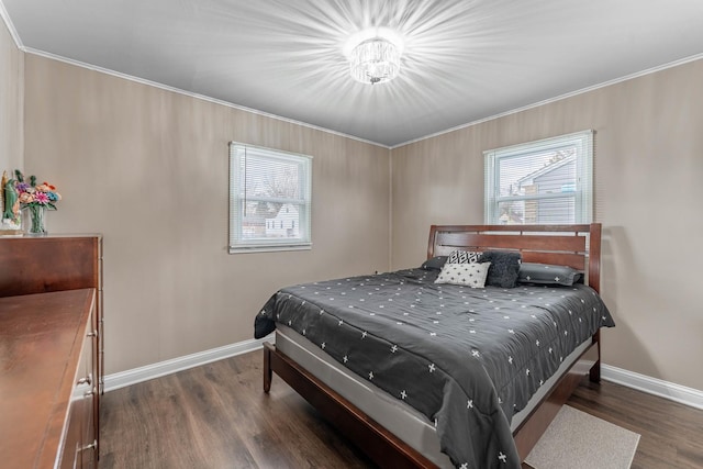 bedroom with crown molding and dark hardwood / wood-style flooring