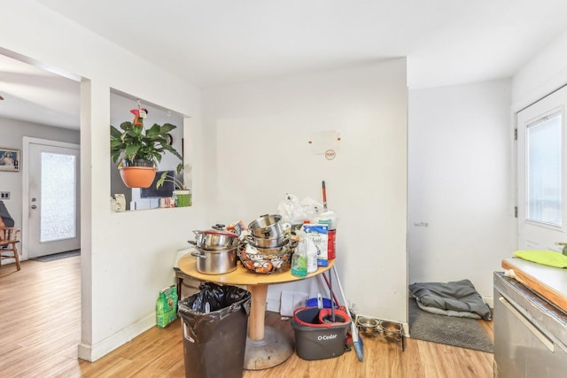 kitchen with a wealth of natural light and light hardwood / wood-style flooring