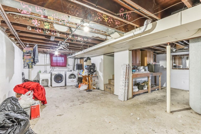 basement featuring sink and washing machine and clothes dryer