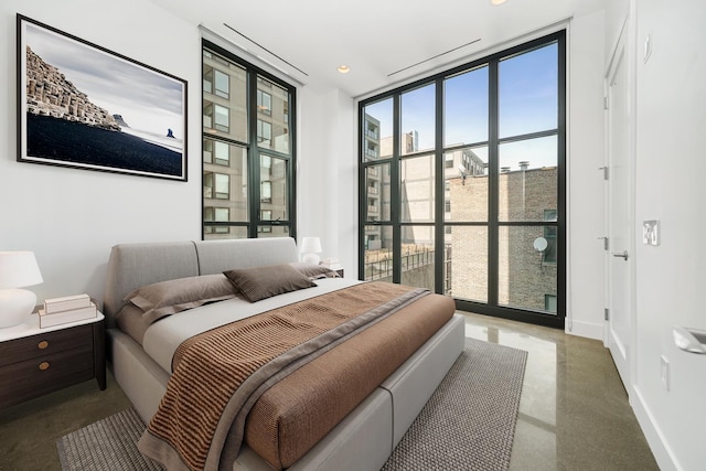 bedroom featuring floor to ceiling windows and multiple windows