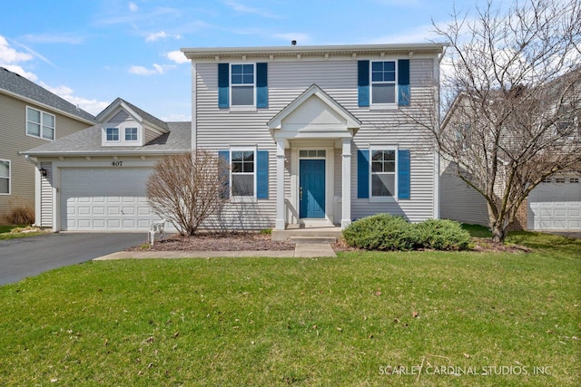 view of front of property with a garage and a front lawn