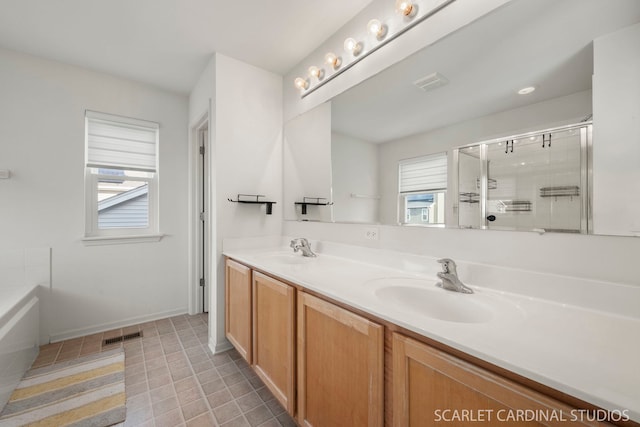 bathroom featuring separate shower and tub, a wealth of natural light, and vanity