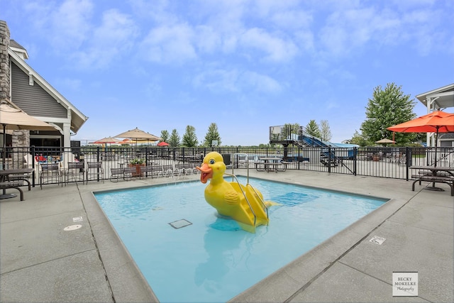 view of swimming pool featuring a patio