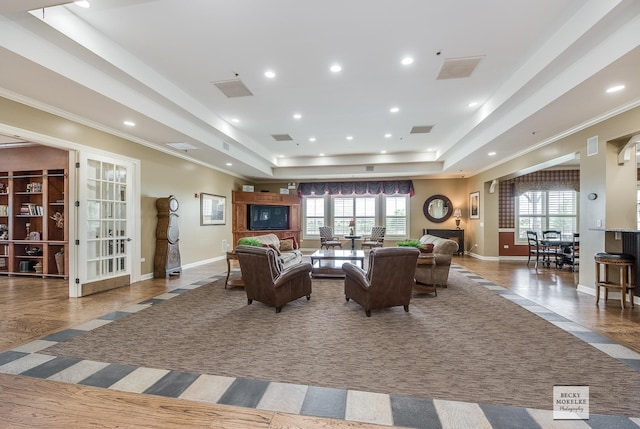 interior space with tile patterned floors and a tray ceiling