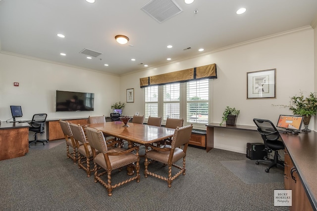 carpeted dining space featuring crown molding