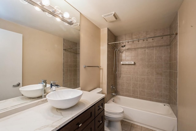 full bath featuring visible vents, toilet, shower / tub combination, tile patterned floors, and vanity