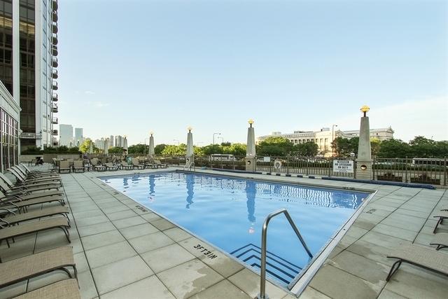 pool featuring a patio area and fence