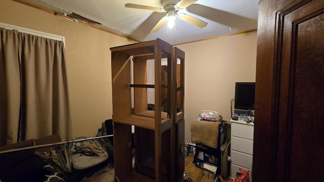 office with ceiling fan, hardwood / wood-style flooring, and ornamental molding