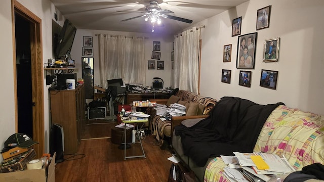 living room with ceiling fan and dark hardwood / wood-style flooring