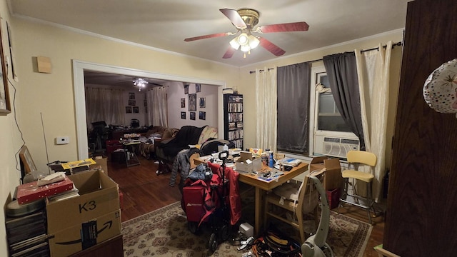 dining space with cooling unit, dark hardwood / wood-style floors, ceiling fan, and ornamental molding