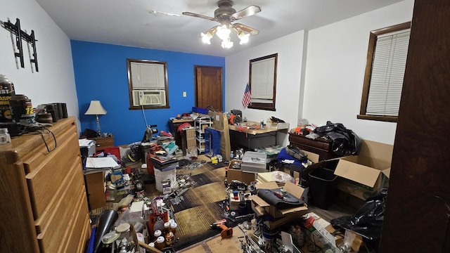 interior space featuring ceiling fan and cooling unit