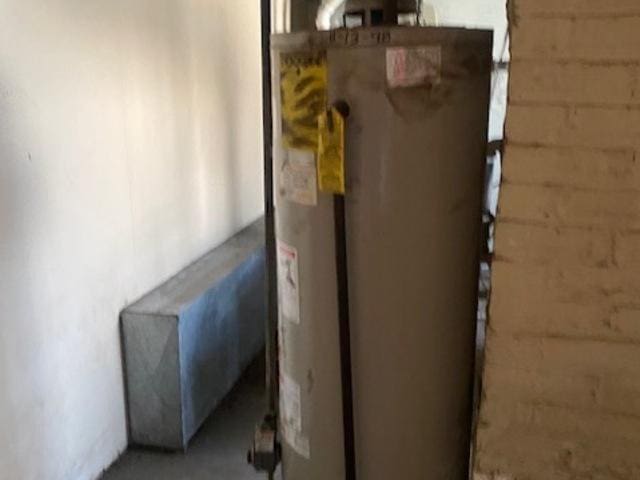 utility room featuring gas water heater