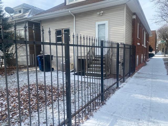 view of snow covered gate