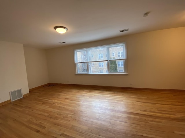 unfurnished room featuring light hardwood / wood-style flooring