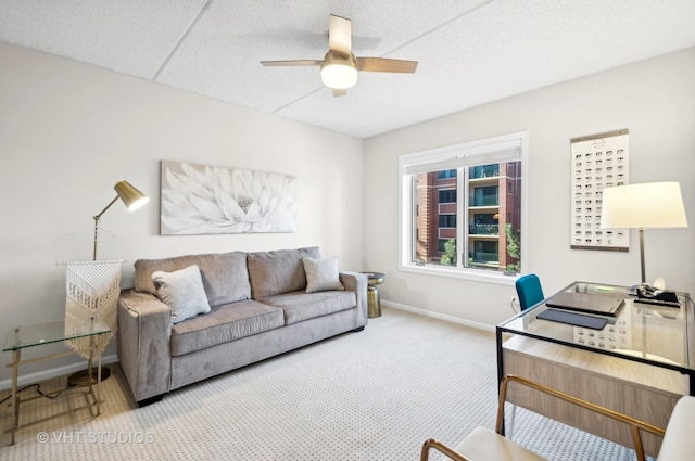 living room with carpet flooring and ceiling fan