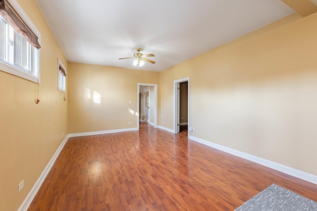 empty room featuring hardwood / wood-style floors and ceiling fan