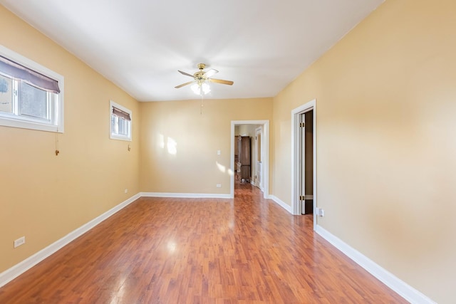 unfurnished room with wood-type flooring and ceiling fan