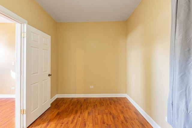 spare room featuring wood-type flooring