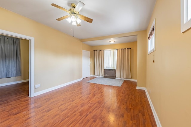 spare room featuring hardwood / wood-style flooring and ceiling fan