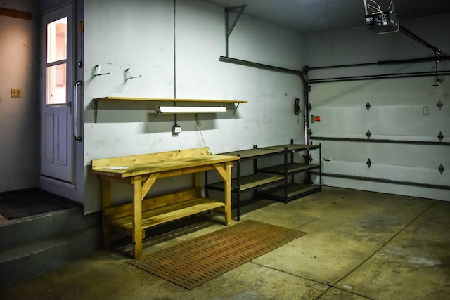 garage featuring a workshop area and a garage door opener