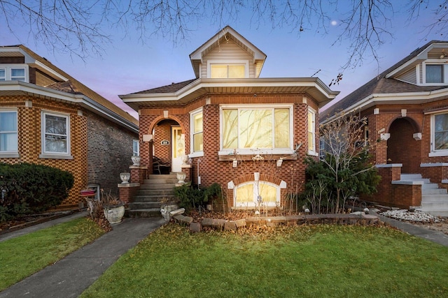 view of front of property with a lawn