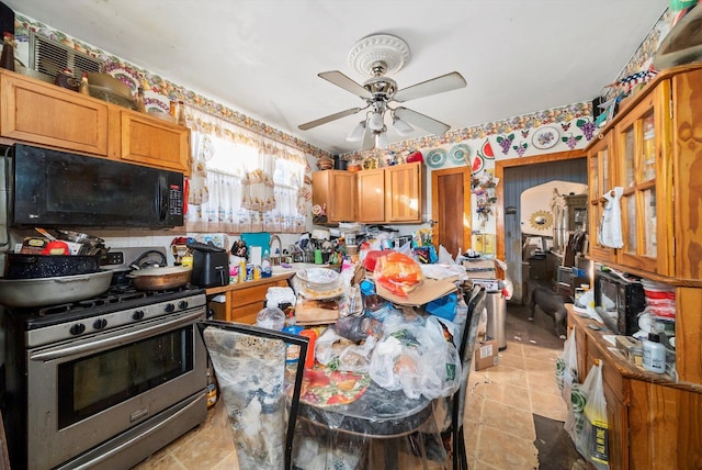 kitchen with stainless steel gas stove and ceiling fan