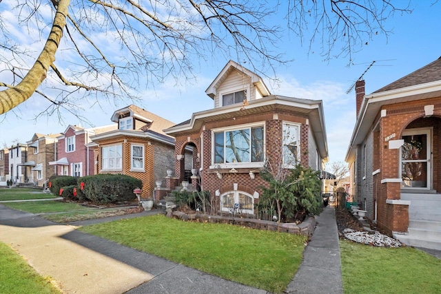 bungalow featuring a front yard