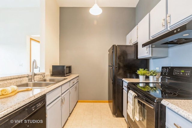 kitchen with white cabinetry, sink, decorative light fixtures, light tile patterned flooring, and black appliances