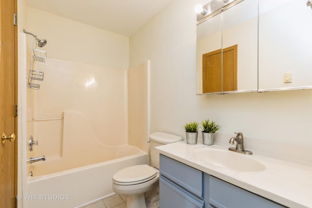 full bathroom featuring tile patterned floors, vanity, toilet, and bathtub / shower combination