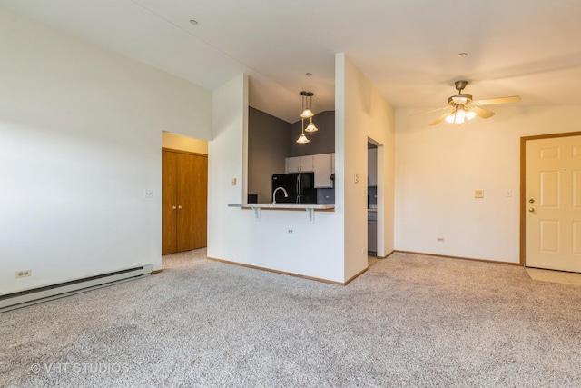 unfurnished living room featuring baseboard heating, ceiling fan, light colored carpet, and lofted ceiling