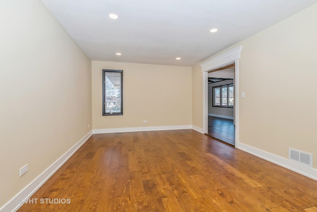 empty room featuring hardwood / wood-style flooring