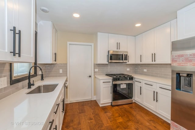 kitchen featuring sink, white cabinetry, and stainless steel appliances