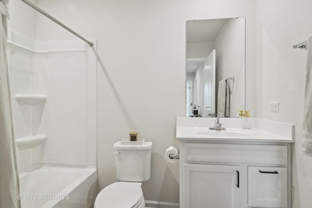 full bathroom with toilet, vanity, and washtub / shower combination