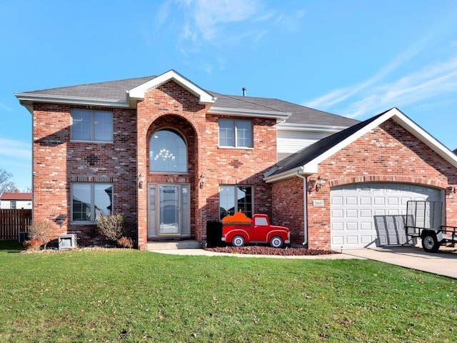 view of property with a garage and a front lawn