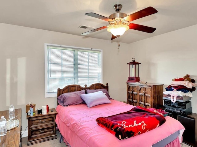 bedroom featuring ceiling fan and carpet floors