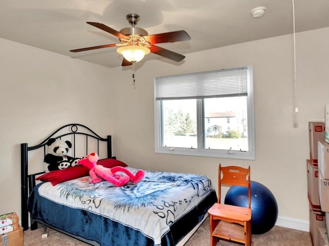 bedroom featuring ceiling fan and carpet floors