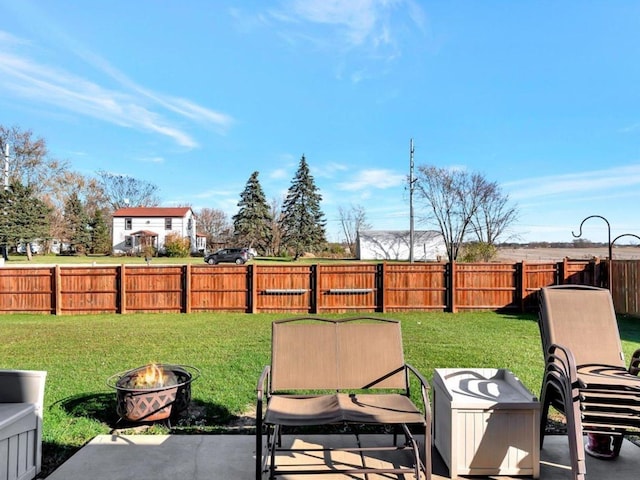 view of yard featuring a patio and an outdoor fire pit