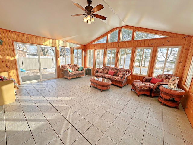 sunroom featuring ceiling fan and vaulted ceiling