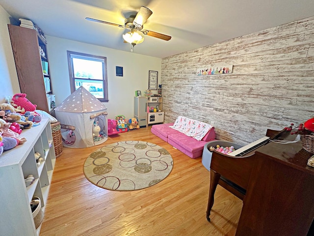 game room featuring hardwood / wood-style flooring and ceiling fan