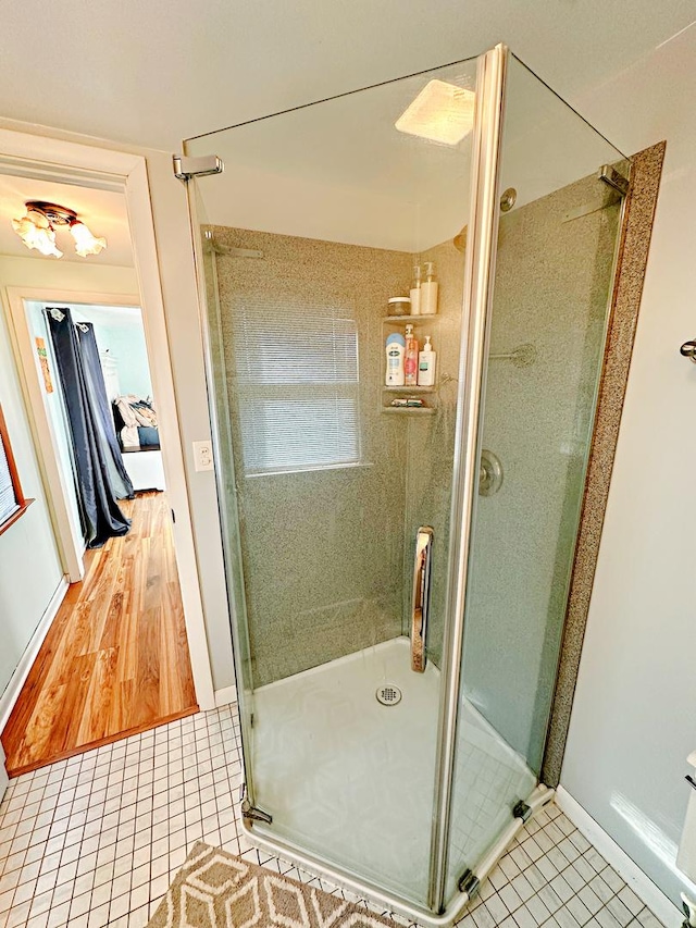 bathroom featuring tile patterned flooring and walk in shower