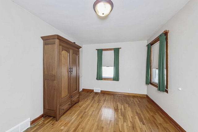 unfurnished bedroom featuring light hardwood / wood-style floors