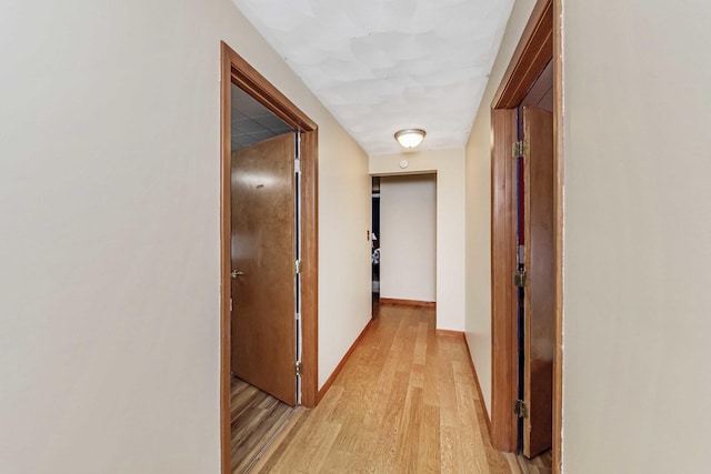 hallway with light wood-type flooring
