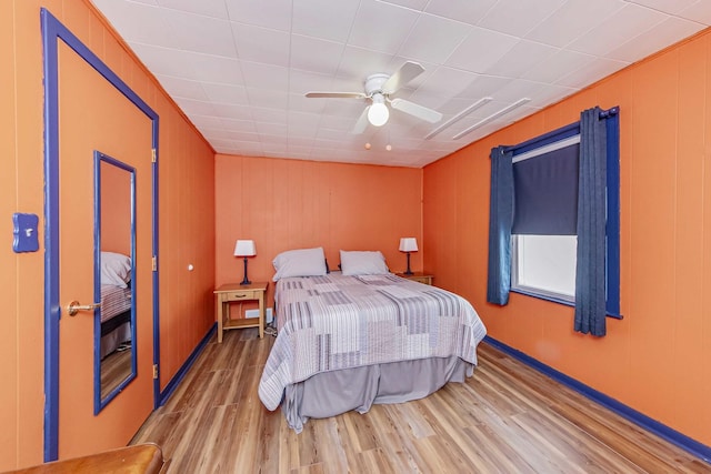bedroom featuring ceiling fan and hardwood / wood-style floors