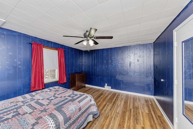 unfurnished bedroom featuring ceiling fan and hardwood / wood-style floors