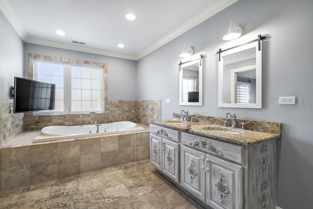 bathroom featuring vanity, tiled bath, and ornamental molding